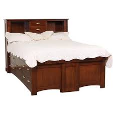 Dark brown textured fabric with nailhead trim. Daniel S Amish Mission 30 3155 3185 3195 3199 California King Solid Wood Pedestal Bed With 10 Drawers And Bookcase Headboard Gill Brothers Furniture Platform Beds Low Profile Beds