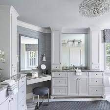 If you have a lot of space, you might opt for a bigger bathroom vanity to fill it. Built In Corner Makeup Vanity With Blue Stool Bathroom Remodel Master Master Bedroom Bathroom Master Bathroom Vanity
