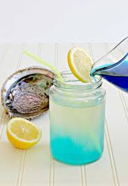 Non Alcoholic Mermaid Lemonade Changes Color From Yellow To Blue Recipe Lemonade Drinks Kid Drinks Recipes Kid Drinks