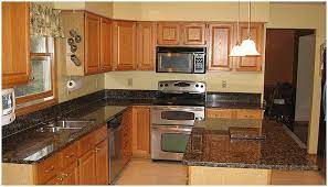 Seriously Does Everyone With These Counters Paint Their Walls Yellow Http Www Floornmore Com Cheap Countertops Brown Granite Countertops Brown Countertop