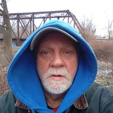 Can anyone identify the man breaking into cars in Holly Street?