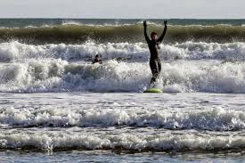 Donate to the daily caller news foundation: Tulsi Gabbard Makes A Splash Surfing In Freezing New Hampshire