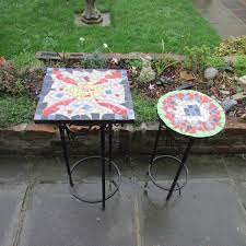 Either choose tiles to work with your table top, or find a table that is the right dimensions for the tiles (and spacers) you'll be using. How To Make Mosaic Designs For Table Tops With Ceramic Tiles Feltmagnet