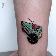 Modern And Minimal Tattoo Of A Cherry Pie On The Left Leg Sketch Style Tattoos Cherry Tattoos Dessert Tattoo