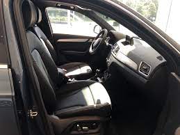 View Of The Cockpit And Front Seats From Passenger Door On The 2018 Audi Q3 With Black Interior Vehicle Available At Aud Audi Dealership Used Luxury Cars Audi