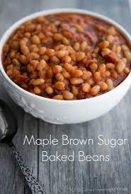 These Maple Brown Sugar Baked Beans Made With Navy Beans Maple Syrup Brown Sugar Peppers And Onions Are Homemade Baked Beans Baked Bean Recipes Bean Recipes