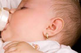 When And How To Get Baby S Ears Pierced Baby Ear Piercing Baby Earrings Silver Ear Cuff