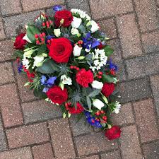 You can even have your floral gift delivered to the church or funeral home as early as the same day. Red White And Blue Teardrop Spray Buy Online Or Call 01474 355007