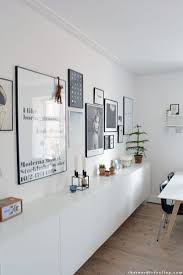Framed Prints Above A Minimal White Sideboard Nordic Living Room Storage Furniture Living Room Family Living Rooms