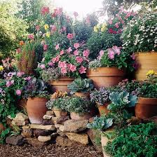 Display Your Favorite Containers And Flowers In Pots Closer To Eye Level Gives Them A Greater Impact 3easycontainergarden Sloped Garden Garden Pots Plants