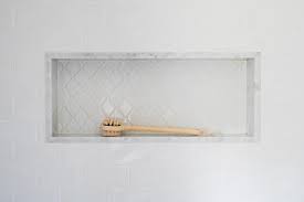 Walk In Shower Featuring White Arabesque Niche Tiles With Marble Trim Surrounded By Subway Tile Shower Niche White Subway Tile Shower Subway Tile Shower Niche