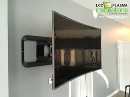 Curved Tv Mounted With Wires Concealed Inside Wall Outlet Installed Behind Tv All Work Was Done By Lcd Plasma Inst Curved Tvs Curved Tv Wall Wall Mounted Tv