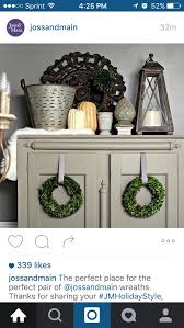 I Love The Decor On Top Of This Armoire And The Wreaths Hanging From The Doors Fridge Decor Bookcase Decor Top Of Cabinet Decor