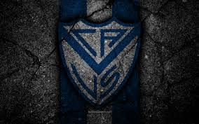 Club atlético vélez sarsfield is an argentine sports club based in liniers, buenos aires.its football team plays in primera división, the highest level of the argentine league system.founded in 1910, the club has spent most of its history in the top tier of argentine football. Herunterladen Hintergrundbild 4k Velez Sarsfield Fc Logo Superliga Aaaj Schwarz Stein Argentinien Fussball Velez Sarsfield Fussball Club Asphalt Textur Fc Velez Sarsfield Mit Einer Auflosung Zu Uberwachen 3840x2400 Bilder Auf Dem Desktop