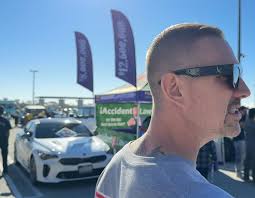 Suspicious person in garage with Kia Stinger