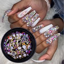 The nails are pale pink with white tips but there is an accent nail full of colorful rhinestones. 1 Box Mix Sizes Crystal Ab Glass Nail Rhinestone Glitter Strass Nail Art Rhinestone For Nail Art Nail Glitter Aliexpress