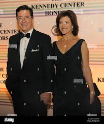 Comdeian Stephen Colbert and his wife Evelyn Magee-Colbert pose for  photographers