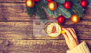 Make these pretty christmas trees made out of sprinkles and ice cream cones! Female Holding Cup Of Coffee With Cream Christmas Tree On A Table Posters For The Wall Posters Relaxation Rustic Cappuccino Myloview Com