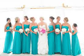 An amazing dress for bridesmaids! Breezy Beach Wedding In Turquoise And Pink Turquoise Bridesmaid Dresses Turquoise Bridesmaid Wedding Bridesmaid Dresses