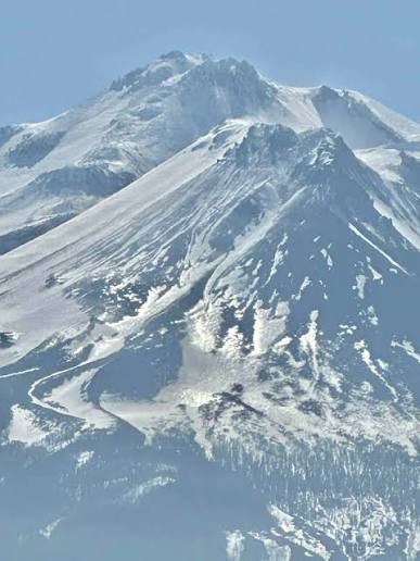 View of Mt. Shasta from airplane window flying into Medford, Oregon
