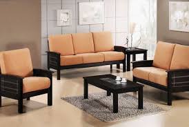 Metallic bright gold upholstered material: Black Wooden Sofa Set With Peach Fabric Of Seats Decor Crave Wooden Sofa Set Sofa Set Sofa Set Designs