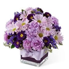 Add purple flowers to your entryway so that guests feel calm and welcome upon entry. Bountiful Daisy Purple Flower Bouquet At Send Flowers