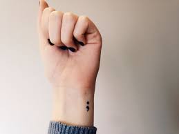 Season two of 13 reasons why begins with clay heading into a tattoo parlour with the intention of getting a semicolon design, a marking that holds special significance to those who wear it. Here S The Profound Meaning Behind The Trendy Semicolon Tattoo