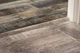 It is constructed in several layers (a bit like laminate flooring) with a resistant wear layer on top, followed by a decorative design layer (a wood or stone image), then a vinyl layer adhered to a waterproof rigid core made of plastic composite, and finally a cork backing. Flooring Trim And Molding
