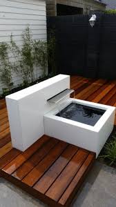 Sleek Garden With Platform And Waterfall Water Features In The Garden Modern Outdoor Fountains Outdoor Gardens Design