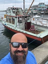 Sharing a caught bass photo in a fishing community