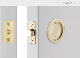 A:the locking mechanism is a pushpin. Round Pocket Door Tubular Emtek Products Inc