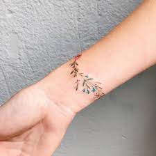 This area is small, so any wrist tattoo ideas that you might have will be just a small sized one too. Flower Bracelet Tattoo On The Right Wrist