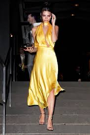 Chrissy Teigen Wore The Dress Trend Many Celebs Support On Her Italy Vacation Trending Dresses Yellow Prom Dress Long Yellow Dress