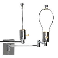 This steel swing arm sconce with an aluminium shade looks right at home in an industrial interior modern chrome swing arm bedroom wall lamp: Pair Of Georg W Hansen Chrome Swing Arm Wall Mounted Lamps At 1stdibs