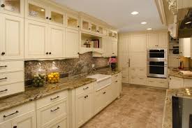 warm tile floors, white cabinets, brown