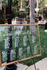 Love Was In The Air At This Dreamy Bohemian Chic Outdoor Wedding Seating Chart Wedding Lights Wedding Decor Wedding Rehearsal Dinner Decorations