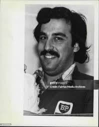 Service station operator Frank Galuzzo, holds his child. Galuzzo was...  News Photo