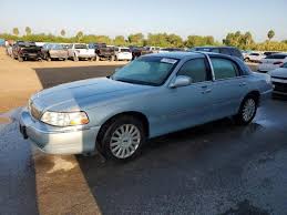 Image result for Light Ice Blue 2005 Town Car