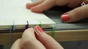 Make sure the plastic is properly in place and drop the page back onto it. How To Bind Single Sheets Bookbinding Tutorial By Sealemon On Youtube This Method Requires Separate Pieces Of B Bookbinding Tutorial Bookbinding Book Making
