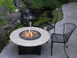 On the deck or patio, a gas fire pit table makes a great gathering space for family and friends. Large Breathtaking Simple Outside Propane Fire Pits Design With Round White Granite And Cool Fish P Propan Feuerstellen Feuerstelle Garten Feuerstellen Tisch