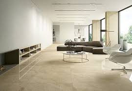 An elegant white living room with marble floor marble floor. Graniti Fiandre Royal Marfil Royal Graniti Fiandre Graniti Fiandre 1 Living Room Stone Effect Porcelain Stone Salas Living Room Living Room Flooring Home