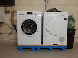 Washing Machine And Drier Placed On Plastic Pallet Easier To Clean Underneath And They Don T Rust From Water Washing Machine Plastic Pallets Pallet Crafts