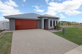 At a1 automate garage you can choose a range of timber look garage doors. A Beautiful Grey Facade Teamed With A Timber Garage Door Home Builders Melbourne Hotondo Homes Home Builders