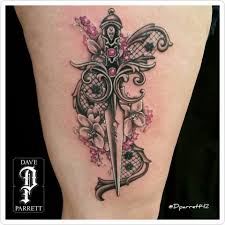 Colorful shin flower and dagger tattoo by shannon parrott. Dparrett42 Dagger And Flower Dagger Flower Flowertattoo Flowerart