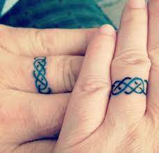 Cdn Skim Gs Images Nblncwgxopyyspwkffto 15 Tattoos That Are The Perfect Wedding Ring Alternative Celtic K Wedding Band Tattoo Tattoo Wedding Rings Ring Tattoos