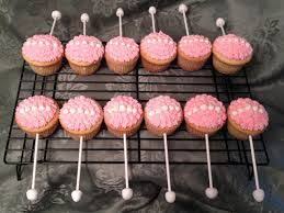 Once the candy had hardened i added a black and white ribbon bow and slid the stick into the side of the cupcakes, creating the baby rattles. 22 Best Baby Rattle Cupcakes Ideas Baby Rattle Cupcakes Rattle Cupcakes Baby Rattle