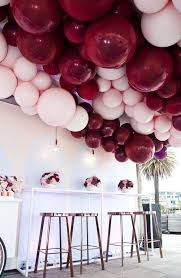 Ceiling Balloon Decoration Ideas For Birthday Party At Home Balloon Roof Feature Pastel Pink And Burgundy Kids Party Ideas Hooray Mag Balloon Ceiling Party Balloons Wedding Balloons