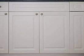 Sand your cabinet doors to get them prepped. How To Paint Laminate Kitchen Cabinets Angela Marie Made