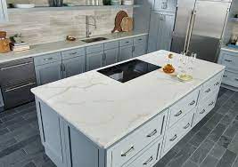 Shaker kitchen cabinets aren't limited to neutral colors—if you're feeling bold, try out blue! Calacatta Classique Quartz Slab Kitchen Design Kitchen Countertops Cost Of Countertops