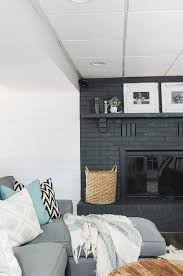 From the moment i saw the full wall of red brick, i wanted to whitewash it. Basement Progress Painted Fireplace And New Purchases Little House Of Four Creating A Beautiful Home One Thrifty Project At A Time Basement Progress Painted Fireplace And New Purchases